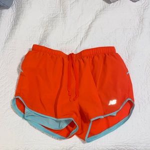 Orange and Teal New Balance Running Shorts